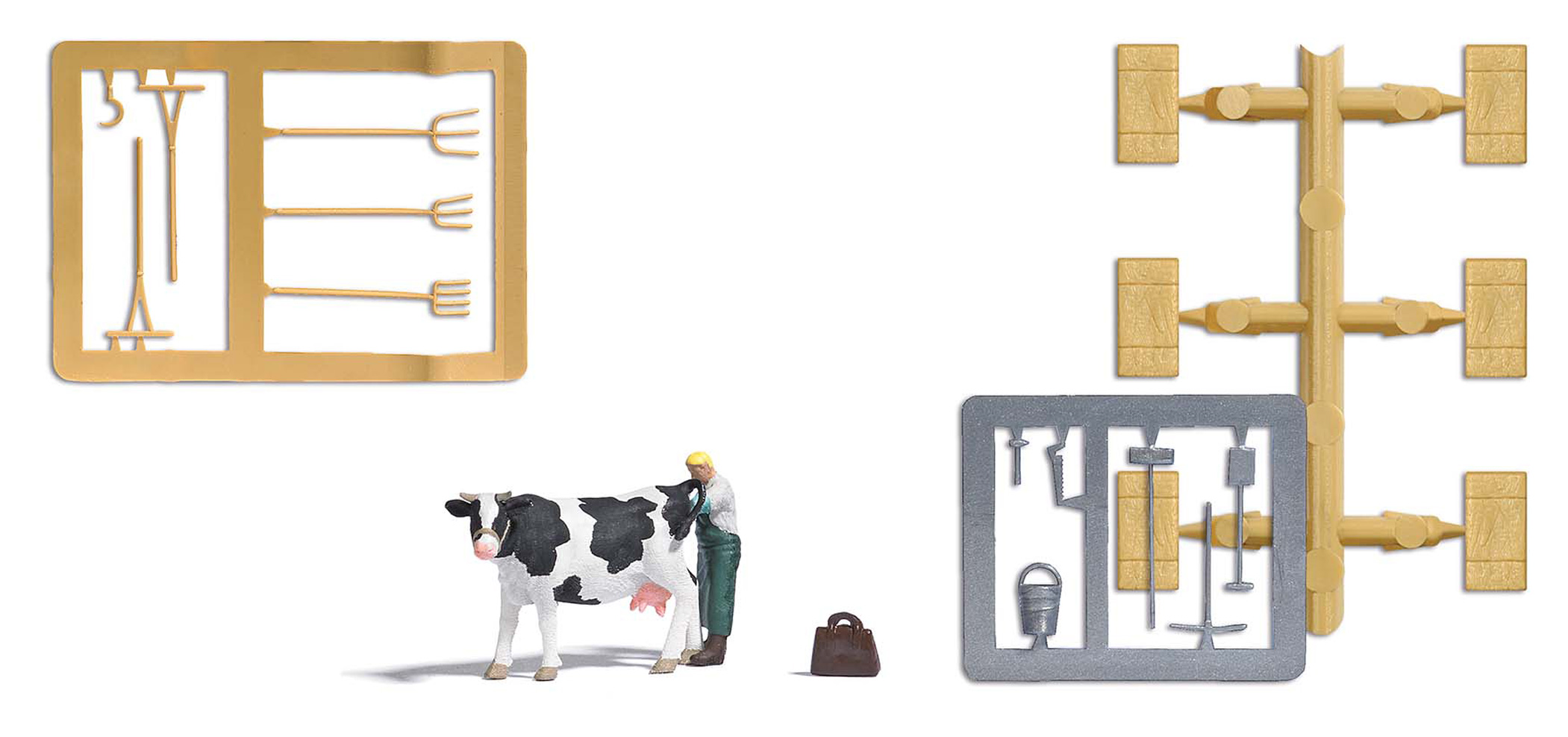 Inséminateur au travail‚ avec vache‚ ballot de foin et outils d’étable