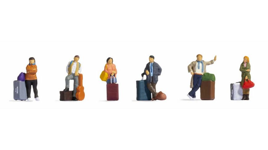 6 voyageurs debouts avec valises et sacs