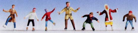 7 figurines sur patins  glace