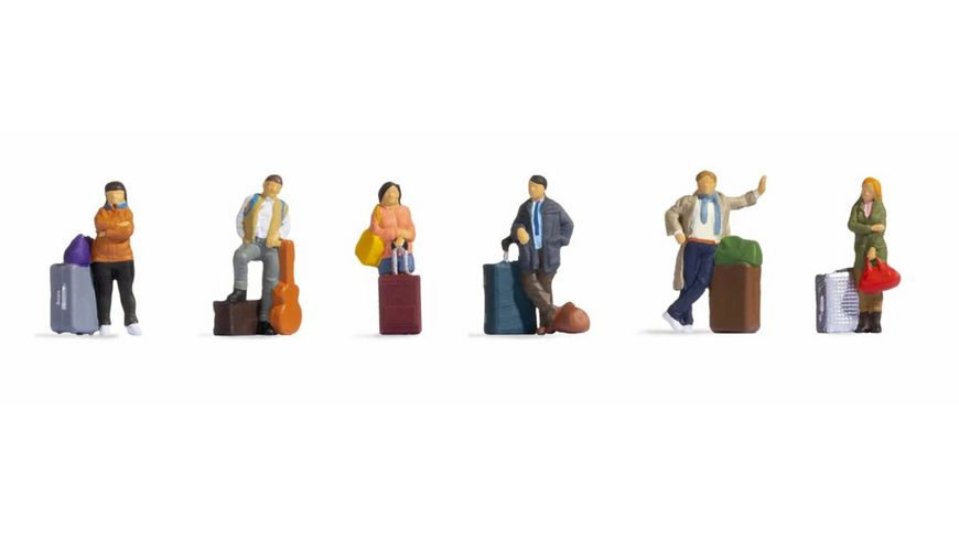 6 voyageurs debouts avec valises et sacs