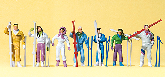 7 personnages aux sports d’hiver‚ avec skis