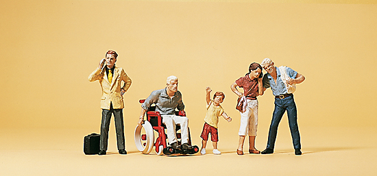 1 handicapé en fauteuil‚ enfant et 3 passants avec valises