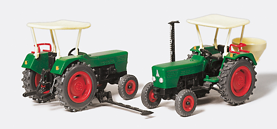 2 tracteurs agricoles avec faucheuse et semeuse de graines en kit
