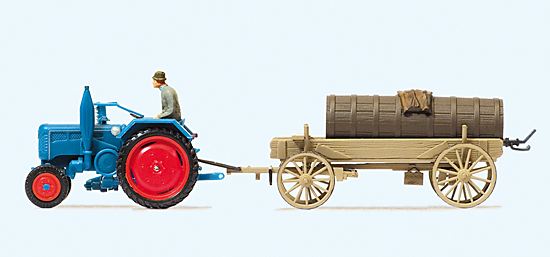 Tracteur LANZ avec faucheuse‚ fermier‚ tractant charette à 4 roues chargée d’une tonne à eau ou à lisier