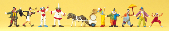 9 Clowns avec accessoires‚ trompette‚ 1 poney ‚chariot avec grosse caisse‚ cymbales etc