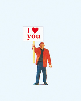 Homme portant une pancarte I love you (avec coeur)