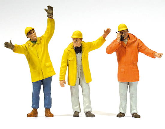 3 Ouvriers de chantier en ciré avec casques