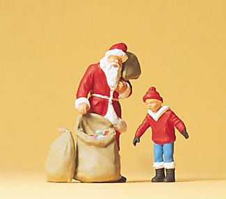 1 père Noël avec 3 sacs de jouets et 1 enfant