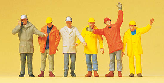 6 ouvriers de chantier avec casques vestes impermables dont 1 avec tlphone portable